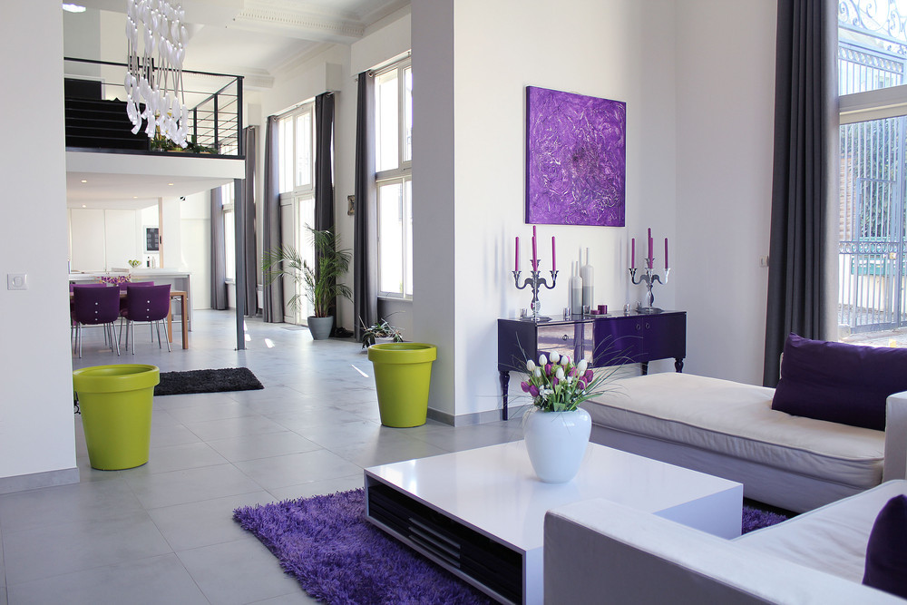 interior-purple-painting-above-purple-table-with-silver-candlesticks-and-purple-candles-contemporary-white-home-with-cute-colorful-interior-design
